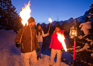 Torchlit walk to a vineyard dinner