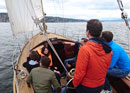 Sailing with a wooden yacht on Lake Zurich